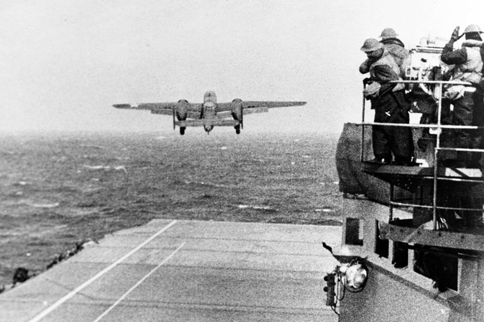 One of the only photographs taken on the day of the Doolittle Raid on April 18, 1941, Jimmy Doolittle and his B-25 is first off the deck of the USS Hornet, headed for Japan. (National Archives)