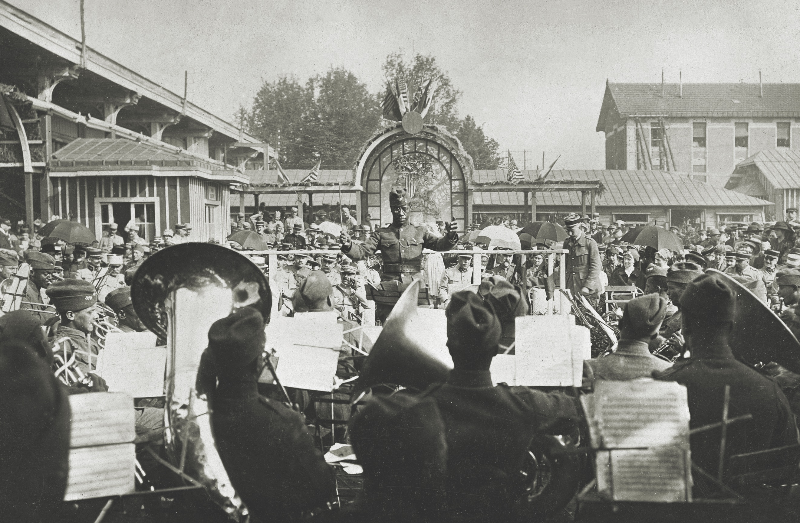 On July 4, 1918, with Europe leading his machine-gun company in combat, Second Lieutenant Eugene Mikell leads the 369th’s band in a concert at French general Henri Gouraud’s headquarters in Châlons-sur-Marne. (Adoc-Photos/Getty Images)