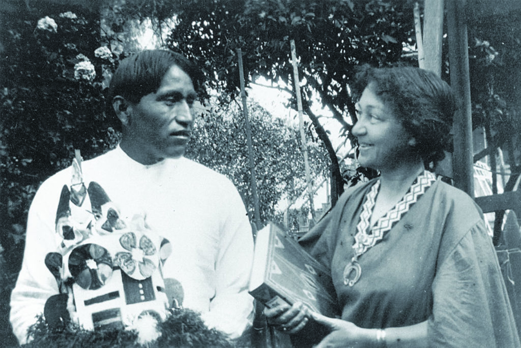 Curtis at a government school in Riverside, California, in 1908 holding a copy of her newly published volume The Indians’ Book, with Tewaqualtewa, a Hopi who contributed to that effort. (Courtesy of Alfred Bredenberg)