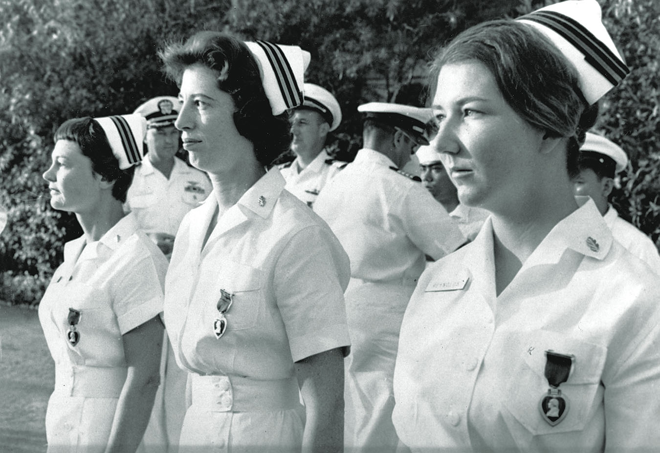 Three of four Navy nurses wounded during the 1964 bombing are decorated with the Purple Heart on Jan. 8, 1965, the first women to receive the award in Vietnam. From left: Lt. Barbara Wooster, Lt. Ruth Ann Mason, Lt.j.g. Ann Darby Reynolds. / AP