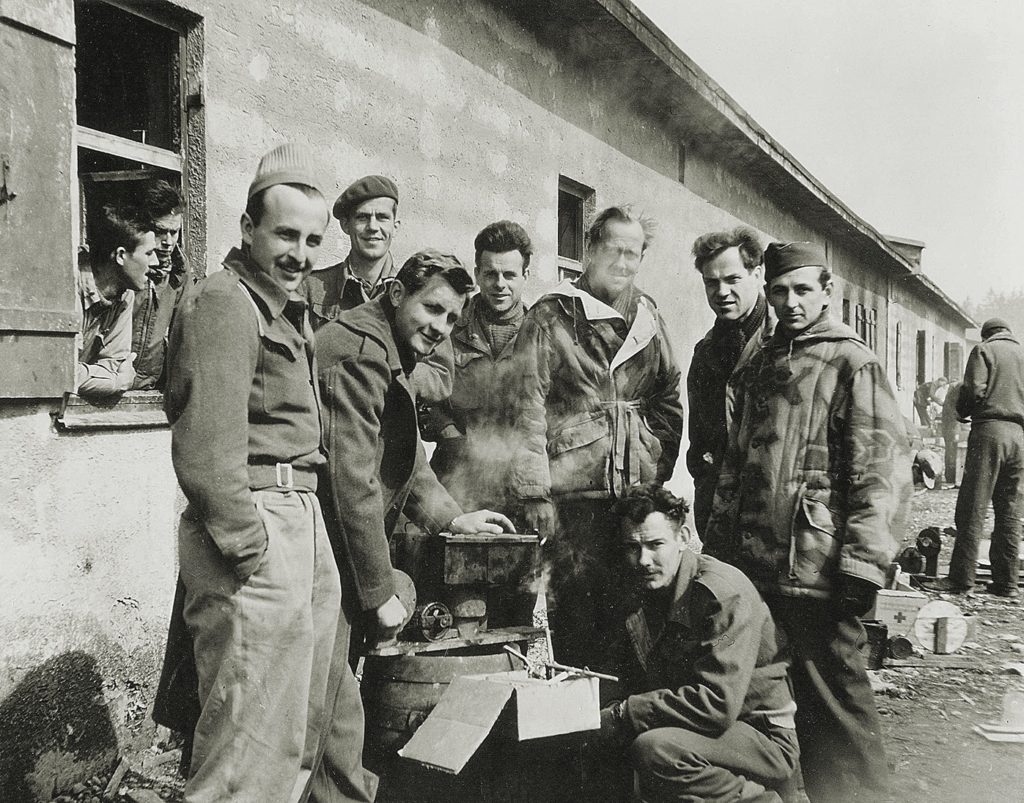 Prisoners at Stalag VII-A gather around an improvised stove. The huge camp, in southern Bavaria, contained POWs from many Allied nations. (Museum of the U.S. Air Force/Courtesy of Ben van Drogenbroek)