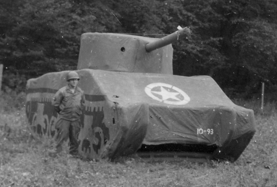 A soldier stands with a dummy M-4 Sherman. (U.S. Army)