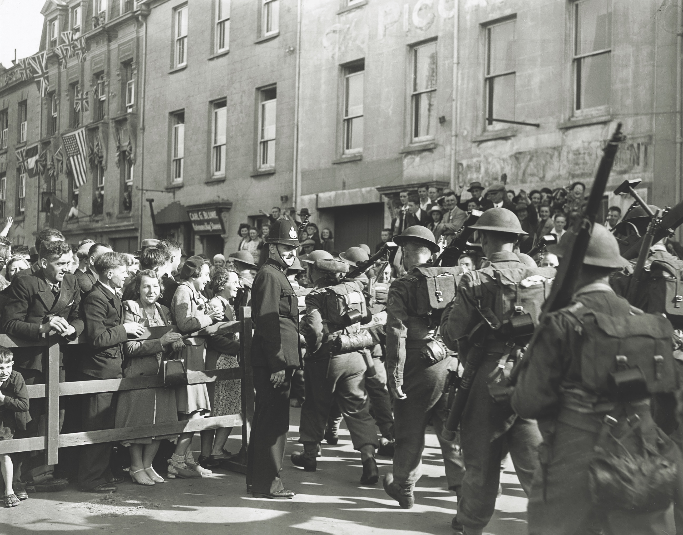 Exuberant crowds welcome British troops on Jersey on May 13, 1945, four days after Germany formally surrendered to the Allies. Vice Admiral Friedrich Hüffmeier had been taken into custody the previous day. (Harry Shepherd/ Getty Images) 