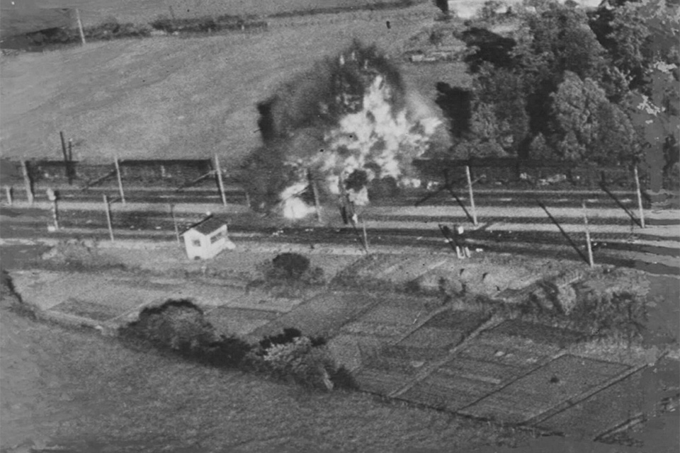 A German train explodes during a strafing attack by American fighters in late summer 1944. (National Archives)