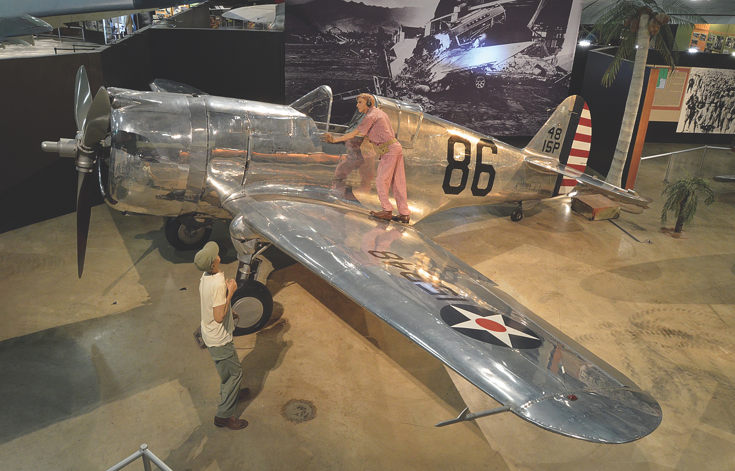 A diorama in the World War II gallery of the National Museum of the U.S. Air Force at Wright-Patterson Air Force Base in Dayton, Ohio, portrays Rasmussen preparing to climb into the cockpit of his Curtiss P-36A Hawk. (National Museum of the U.S. Air Force)