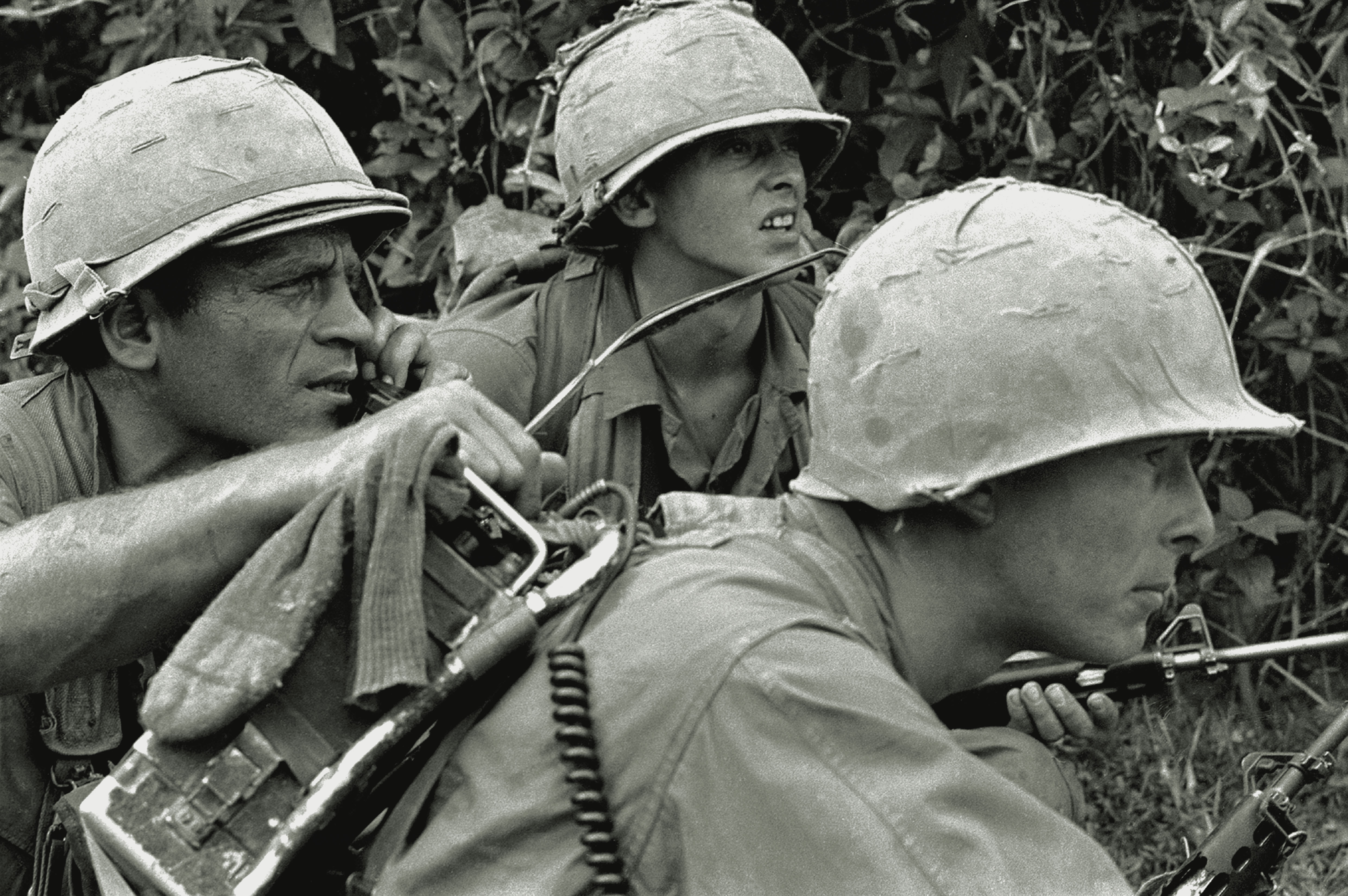 Staff Sgt. Joe Musial, on the radio, in Company D, 1st Battalion, 8th Cavalry Regiment, 1st Cavalry Division (Airmobile), learns that the rest of his company is pinned down on the Bong Son plain of the central coastlands in February 1967. Just a couple of months earlier, in December 1966, Company D, 1st Battalion, 12th Cavalry Regiment, found itself in a similar predicament in the same region. / Robert Hodierne