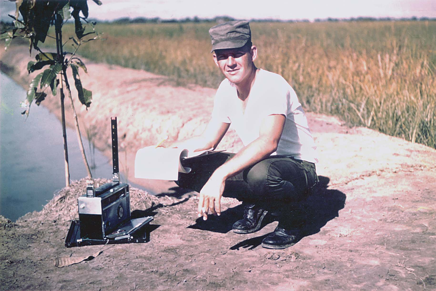 Davis is shown with radio direction finder equipment similar to that used on missions. Teams went into an area with a suspected transmitter, and when they detected a signal they used the finder to get a fix on it. / Mark D. Raab
