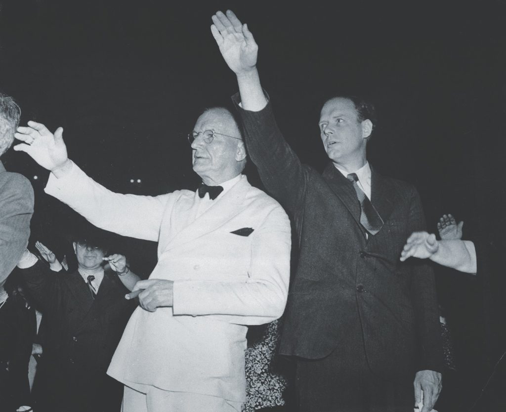 America First Committee leaders Charles Lindbergh (right) and Senator Burton Wheeler salute the American flag at a 1941 rally in New York. Ingalls followed in Lindberghâ€™s footsteps both as an air pioneer and an ardent isolationist. (Bettmann/Getty Images) 