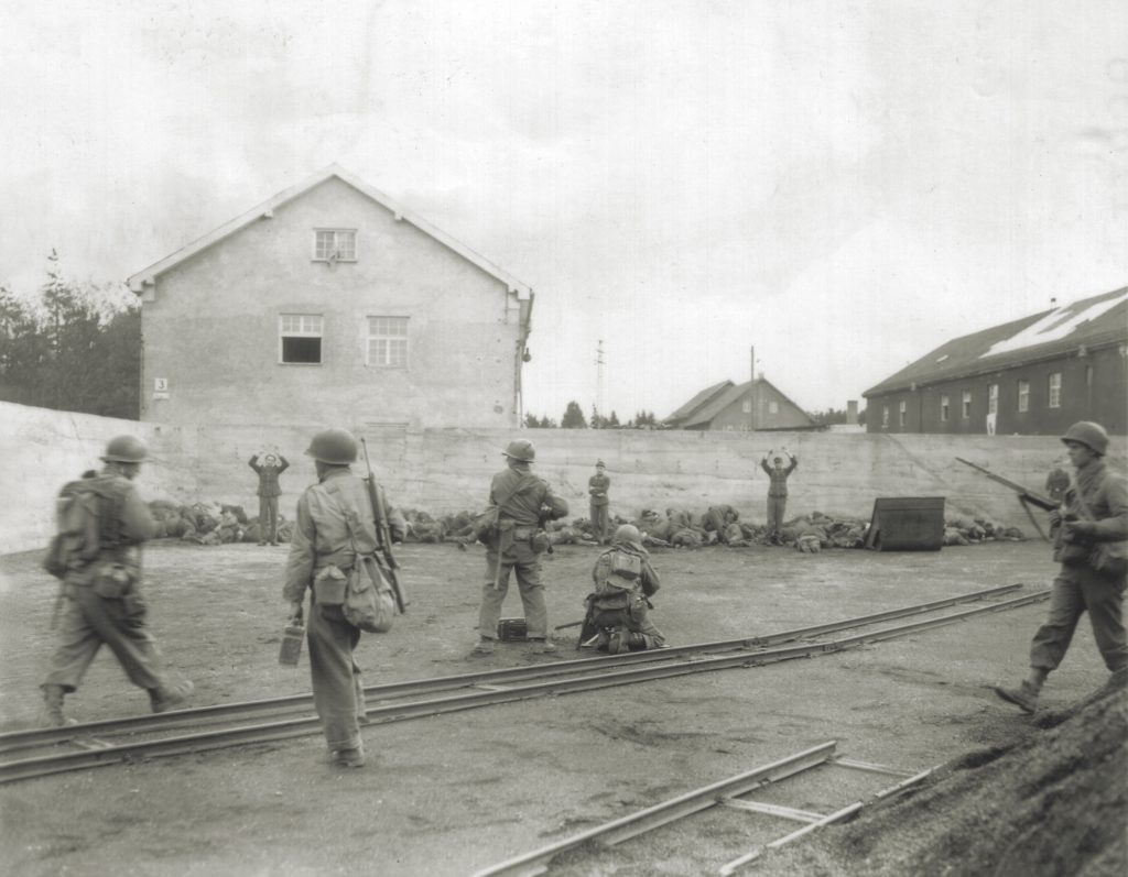 American troops gun down SS men in the camp’s coal yard. Seventeen Germans were killed there, with others wounded. (National Archives)