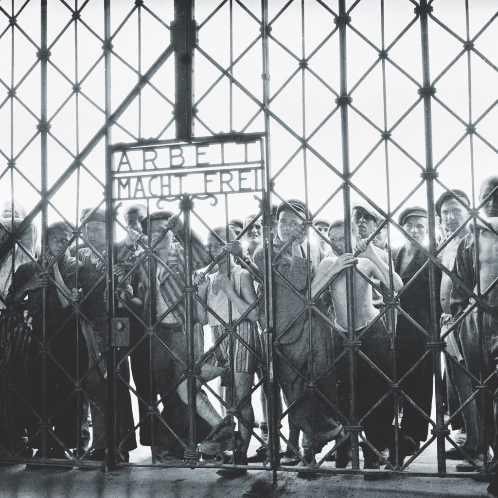 “Work makes you free,” the notorious slogan on a Dachau gate reads. For many of its inmates, the camp mostly meant death. (Maurice EDE/Gamma-Rapho via Getty Images)