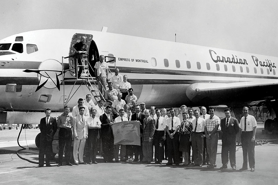 The flight and ground crews for the DC-8 supersonic run included flight test engineer Richard Edwards (third from left). Magruder is standing behind the sign in a white shirt. (Courtesy of Richard H. Edwards via Caroline Sheen)