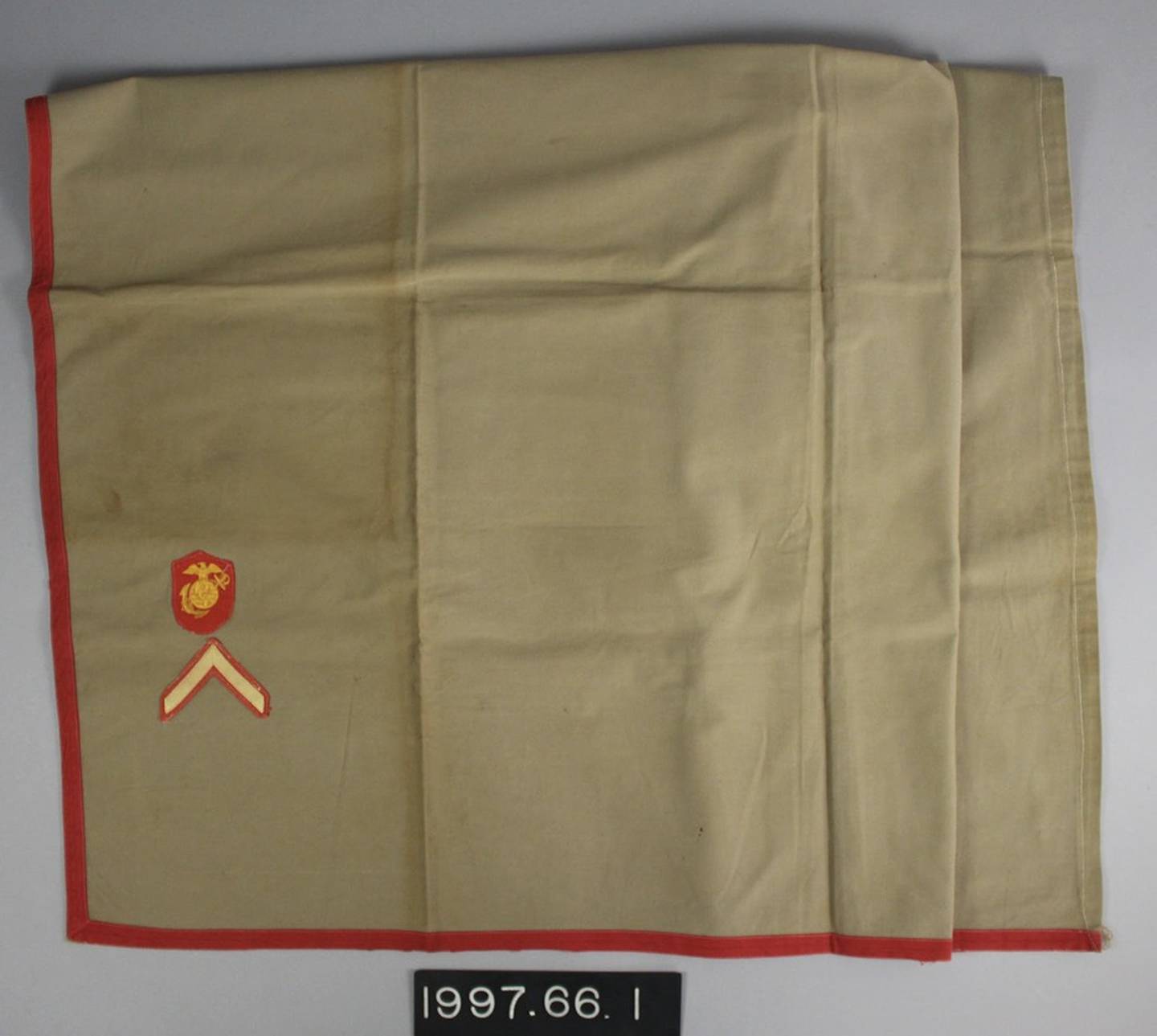 The Lava-Lava is made of a thick cotton canvas fabric. It is wrapped around the Marine’s waist and folded tightly in place. A red sash or cartridge belt assists in keeping it firmly in place. (Collection of the National Museum of the Marine Corps)