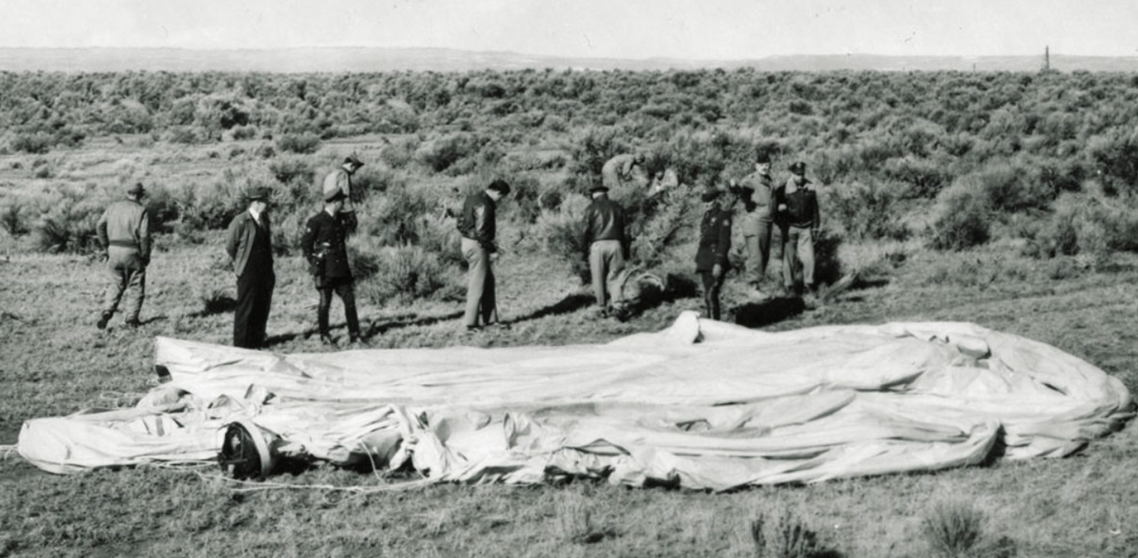 American military and government officials congregate around a deflated but complete Japanese balloon bomb discovered near Burns, Oregon, on February 23, 1945. (U.S. Air Force/National Archives)