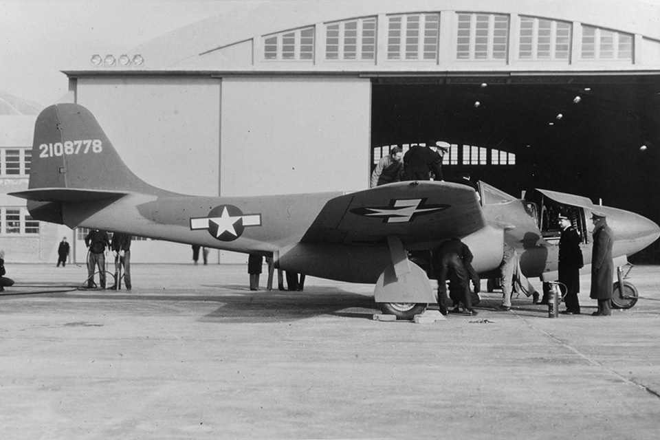 A YP-59A being inspected by U.S. Navy personel. On April 21, 1943, Captain Frederick M. Trapnell became the first U.S. Navy pilot to fly the jet. Three of the 66 Airacomets were purchased by the Navy as XF2L-1s, but the Navy did not adopt a pure jet fighter until 1946. (National Archives)
