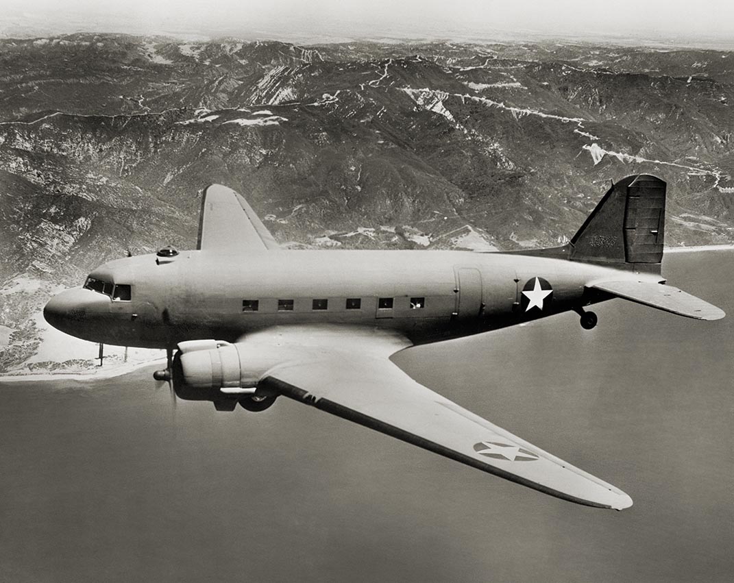 The USAAF’s C-47 Skytrain and its Navy variant, the R4D, were the backbone of air transport operations in the Pacific Theater. / Universal History Archive, Getty Images