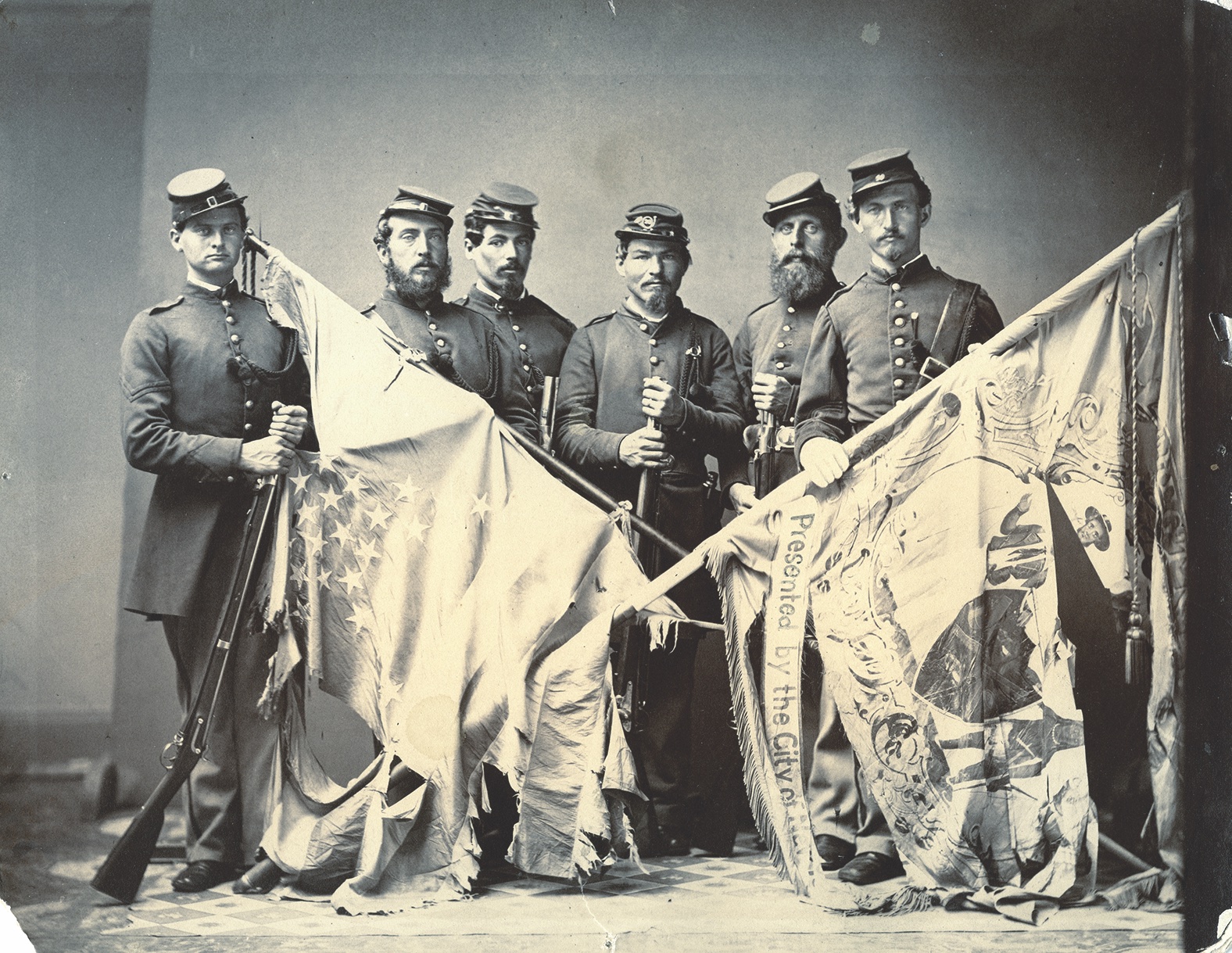 Veterans of the 20th New York color guard with their battle-shredded banners, including the state flag presented by the â€œCity of New York.â€ The 20th was primarily composed of German immigrants from New York City and New Jersey who belonged to Turnverein, or German gymnastic clubs. Members of such clubs were known as Turners, and the regiment was nicknamed the â€œTurner Regiment.â€ The sprightly soldiers put on occasional gymnastic shows in camp. The 20th served from May 1861 to June 1863. Aside from Antietam, the regimentâ€™s other major fight came at the May 1863 Battle of Salem Church during the Chancellorsville Campaign. (The Buffalo History Museum)