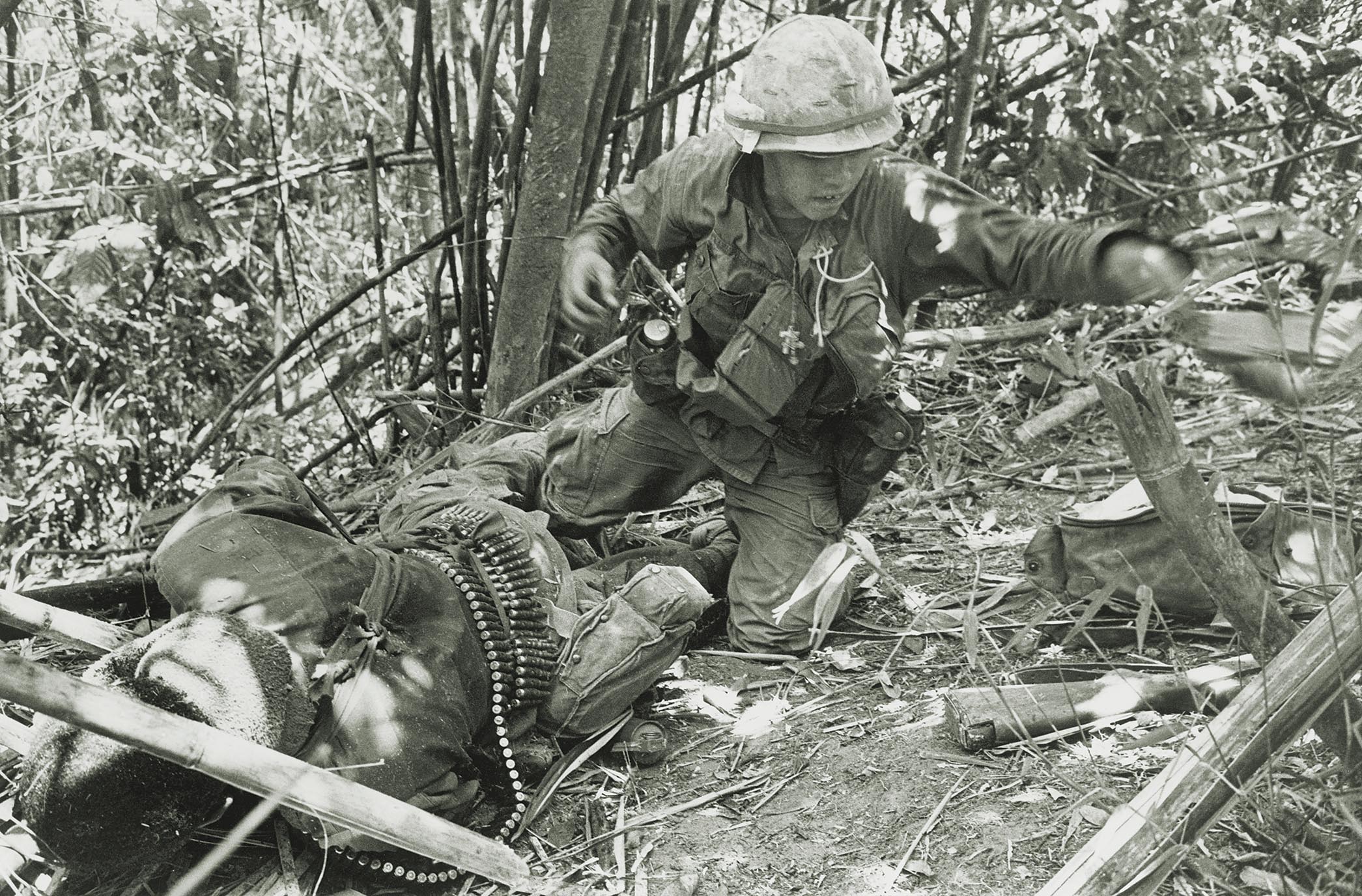 As fighting raged at Tam Ky, a rocket exploded directly behind a 101st Airborne soldier, wounding him during an assault on Hamburger Hill, May 20, 1969. / Getty Images