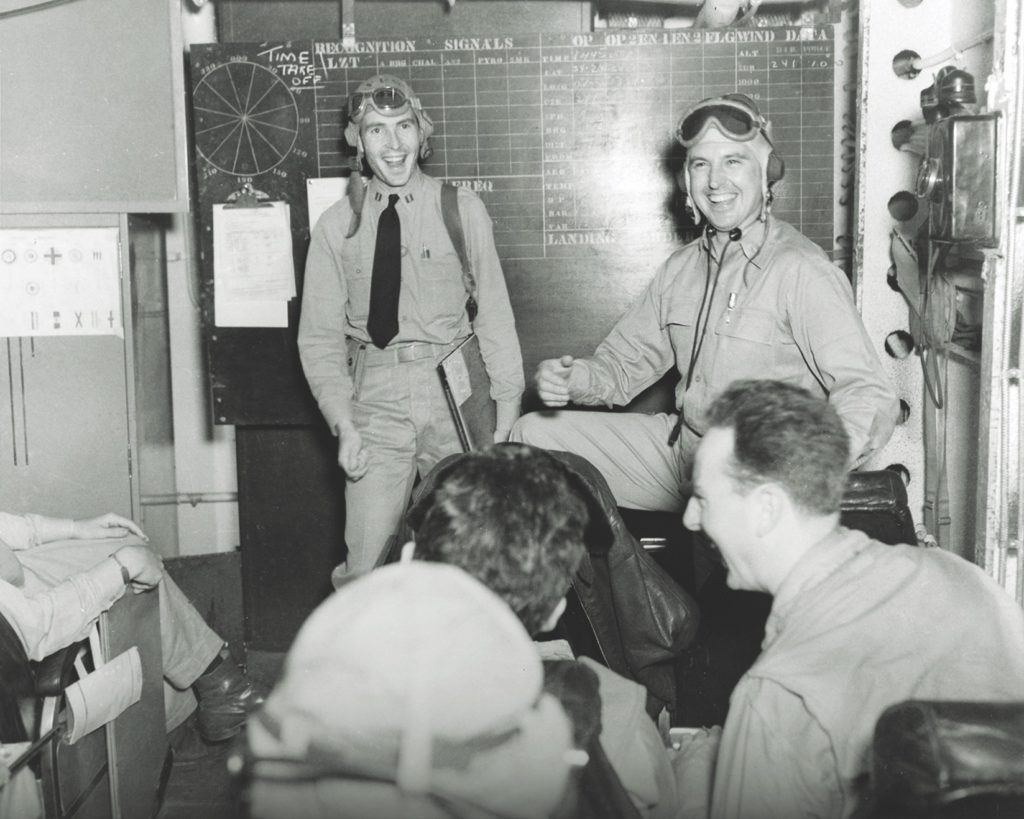 Pilots sing in their ready room (above) aboard the USS Ranger before the 1942 invasion of Morocco. Judging by the smiles, this was not a sanctioned song—although the army and navy tried their best to inspire by dispensing official lyrics on “Hit Kit” fliers (below) and music on V-discs. (Stocktrek Images, Inc./Alamy Stock Photo)
