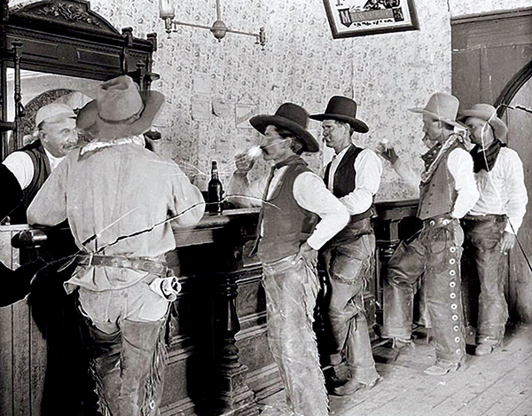 Cowboys belly up to bar in Tascosa, Texas