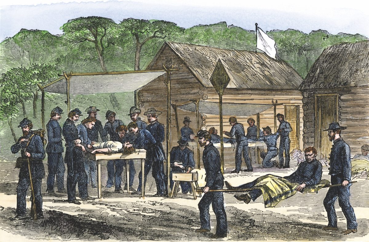 Litter bearers bringing wounded men to a Union field hospital after a Civil War battle in Virginia 1863.