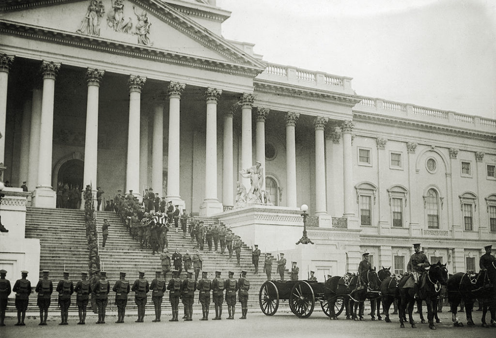 On Armistice Day, pallbearers carry the coffin of the 'Unknown Soldier' of World War I down the steps of the Capitol in Washington DC to the gun carriage which will bear it to Arlington National Cemetery, 11th November 1921. (Photo by Harris & Ewing/Paul Thompson/FPG/Hulton Archive/Getty Images)
