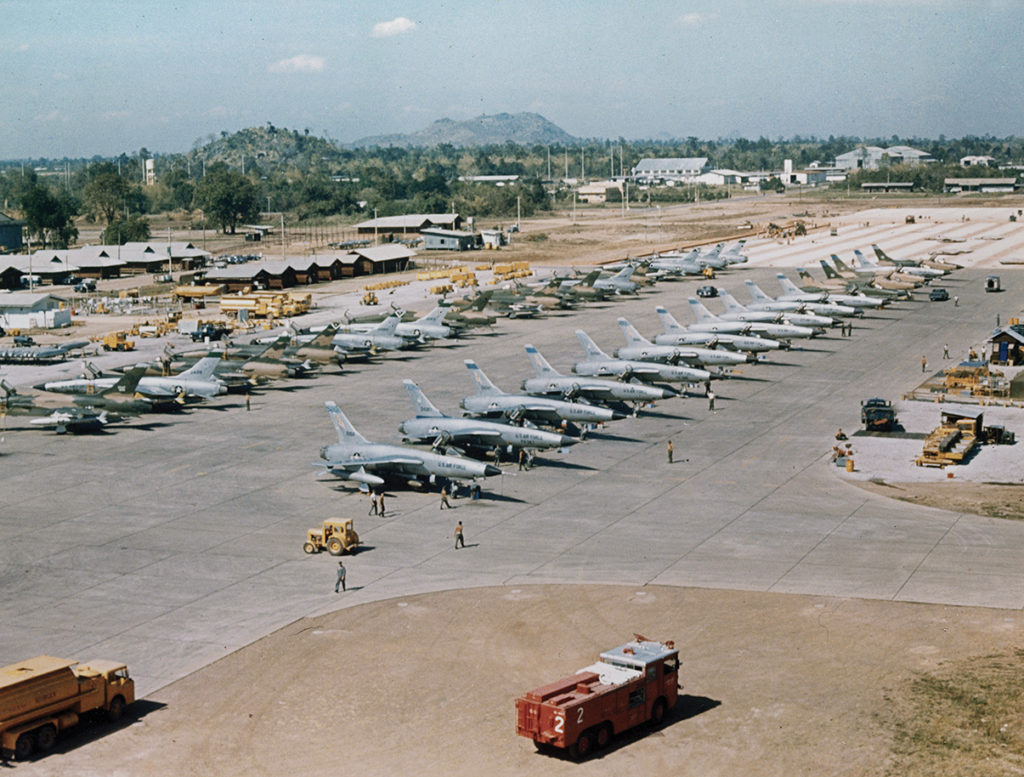 F-105D Thunderchief fighter-bombers rest on the airfield at Takhli Royal Thai Air Force Base in 1965. 