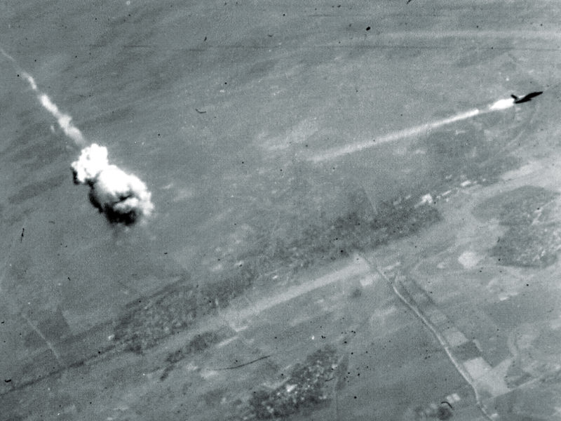 SA-2 surface to air missile F-105 trailing smoke just after interception by an SA-2. The SA-2 did not actually hit an aircraft—the fuse automatically went off when it neared the target, throwing deadly fragments over a wide area. (U.S. Air Force photo)