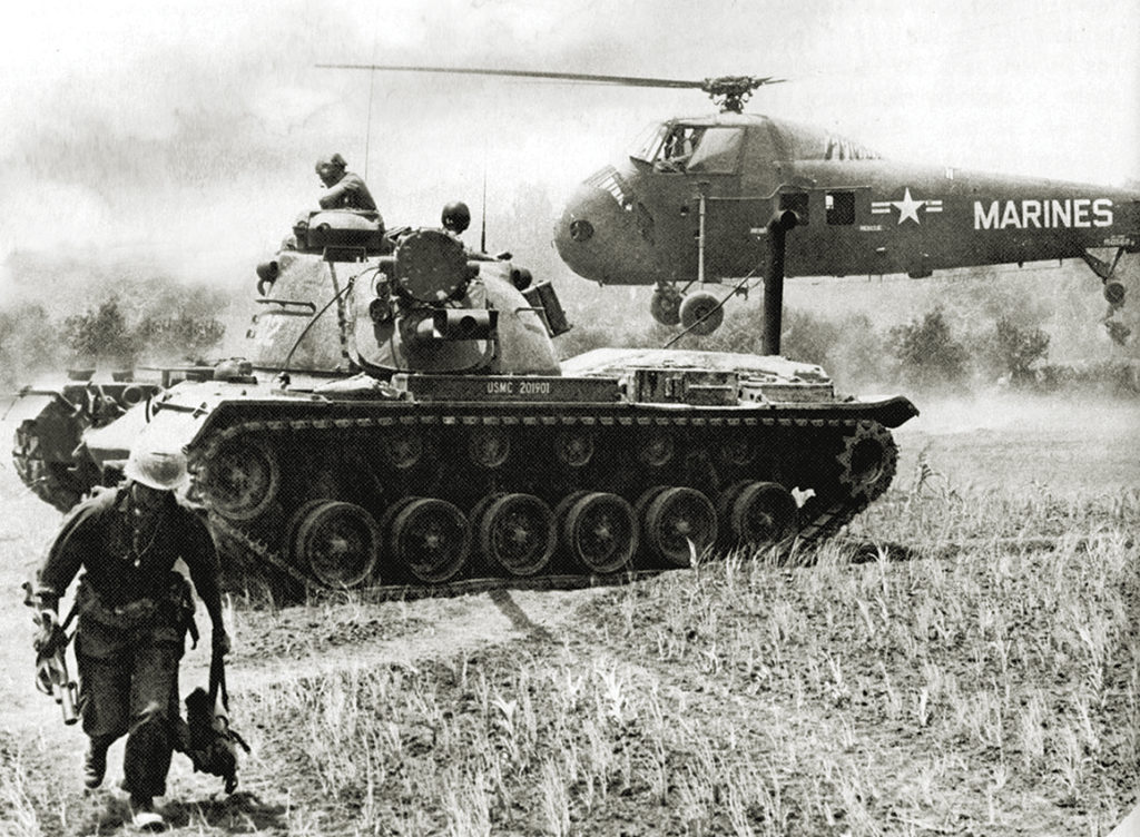 Mandatory Credit: Photo by Universal History Archive/UIG/Shutterstock (2541865a) A US MAG-16 helicopter evacuates STARLITE casualties, while a Marine M-48 tank stands guard. The Marine on the left carries a M-79 grenade launcher. History