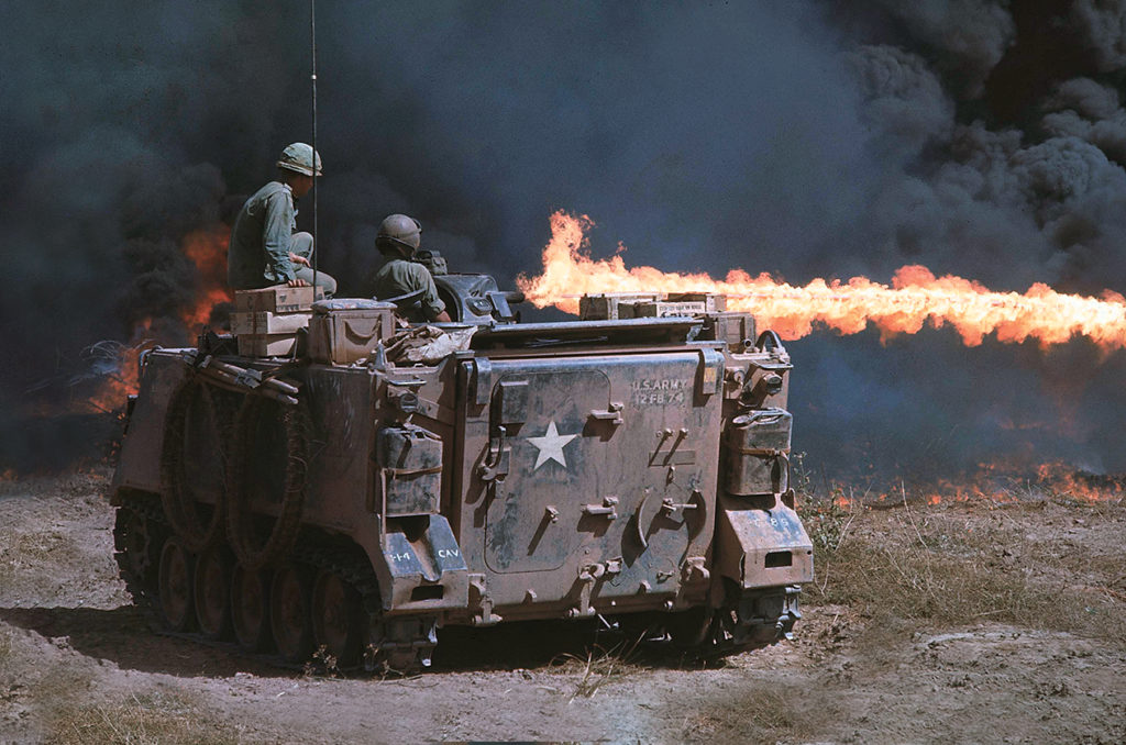 US soldiers of 1st Squadron, 4th Cavalry on Zippo Tracks armored personnel carriers incinerating Iron Triangle area during Operation Cedar Falls. (Photo by Dick Swanson/Getty Images)