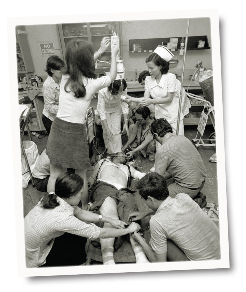 Photo of An Air Force crewman seriously injured in the crash of a C-5A Galaxy transport plane on April 4, 1975, is treated at a Saigon hospital. The aircraft was carrying Vietnamese orphans to the U.S. as Saigon was about to fall to communist forces. 
