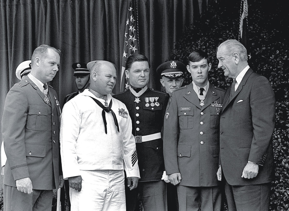 President Lyndon Johnson, right, poses May 14, 1968 at the White House with four winners of the nation's highest award, the Medal of Honor. Decorated for valor in Vietnam, they are, from left: Air Force Capt. Gerald O. Young, of Anacortes, Wash.; Navy Bosn"s Mate James E. Williams, of Rock Hill, S.C.; Marine Sgt. Richard A. Pittman, of Stockton, Calif. and Army Spc. 5 Charles C. Hagmeister, of Lincoln, Neb. Others are unidentified. (AP photo)