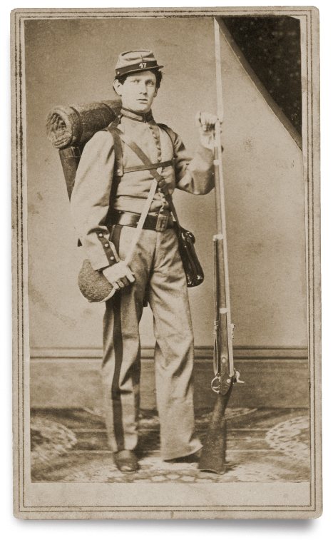 Phot of Private Henry F. Lincoln of Co. B, 47th New York Infantry Regiment, with bayoneted rifle, canteen, haversack, knapsack, and bedroll.