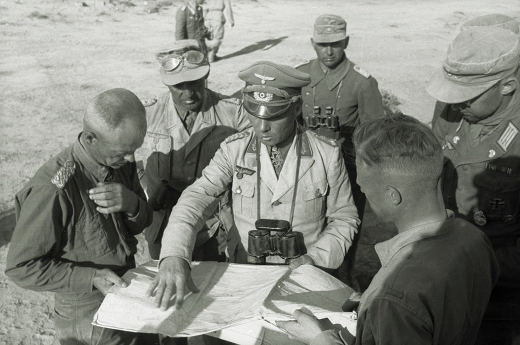 Rommel consulting a map in North Africa