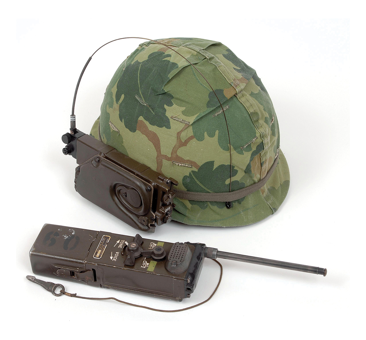 American Vietnam period M1 pattern GI helmet with squad level radio receiver AN/PRR-9 and transmitter AN/PRT-4A.