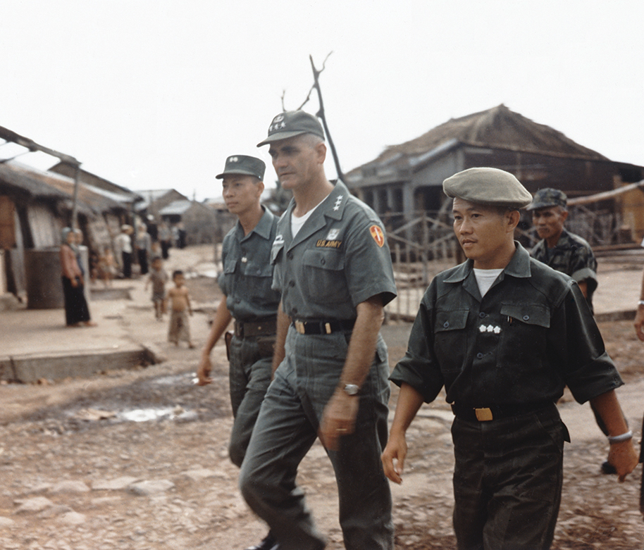 General William L.C. Westmoreland tours the fishing village of Vam Lang during his first orientation trip to the area, May 5 1964. (Photo by Fotosearch/Getty Images).