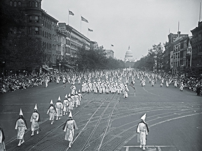 Ku Klux Klan marching down Pennsylvania Ave., Washington, D.C ca. 1926. (Photo by: Hum Images/Universal Images Group via Getty Images)