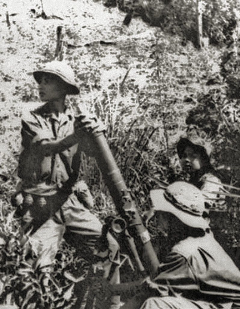 Photo of North Vietnamese troops support an assault with an M-43 120 mm mortar.