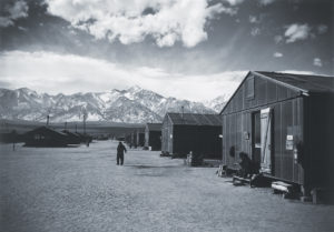 Photo of Manzanar Relocation Center. During the winter the Manzanar Relocation Center had no hope of disguising itself as anything but what it was: punitive confinement.