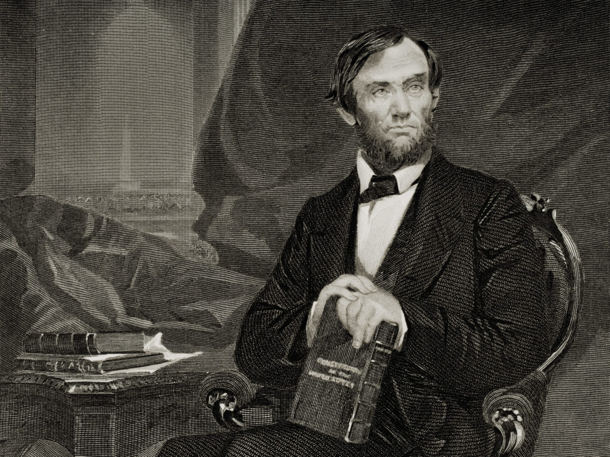 Abraham Lincoln posing with books