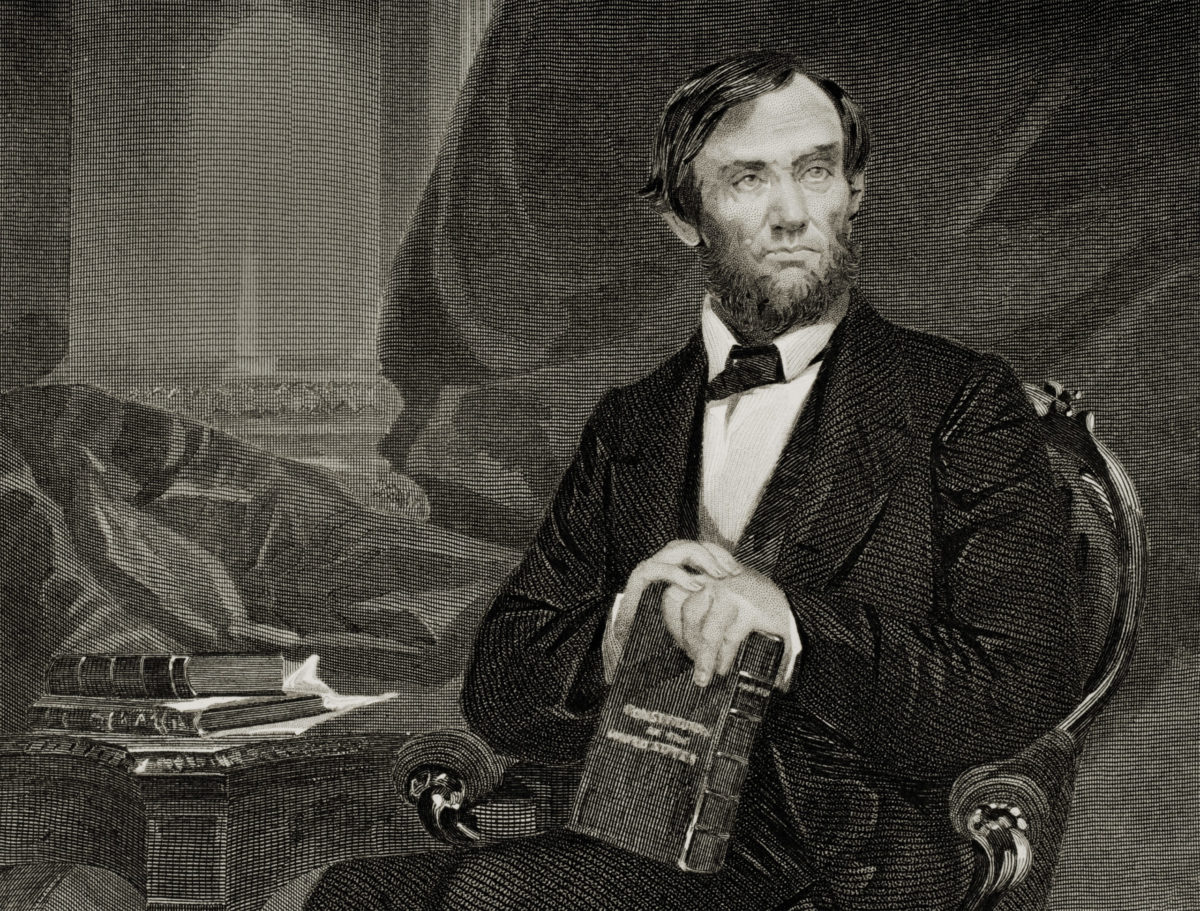 Abraham Lincoln posing with books