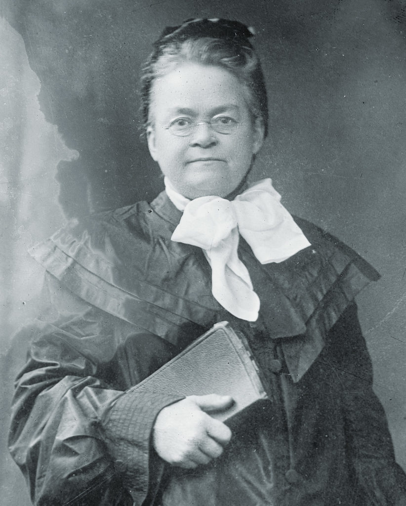Carrie Nation poses with book