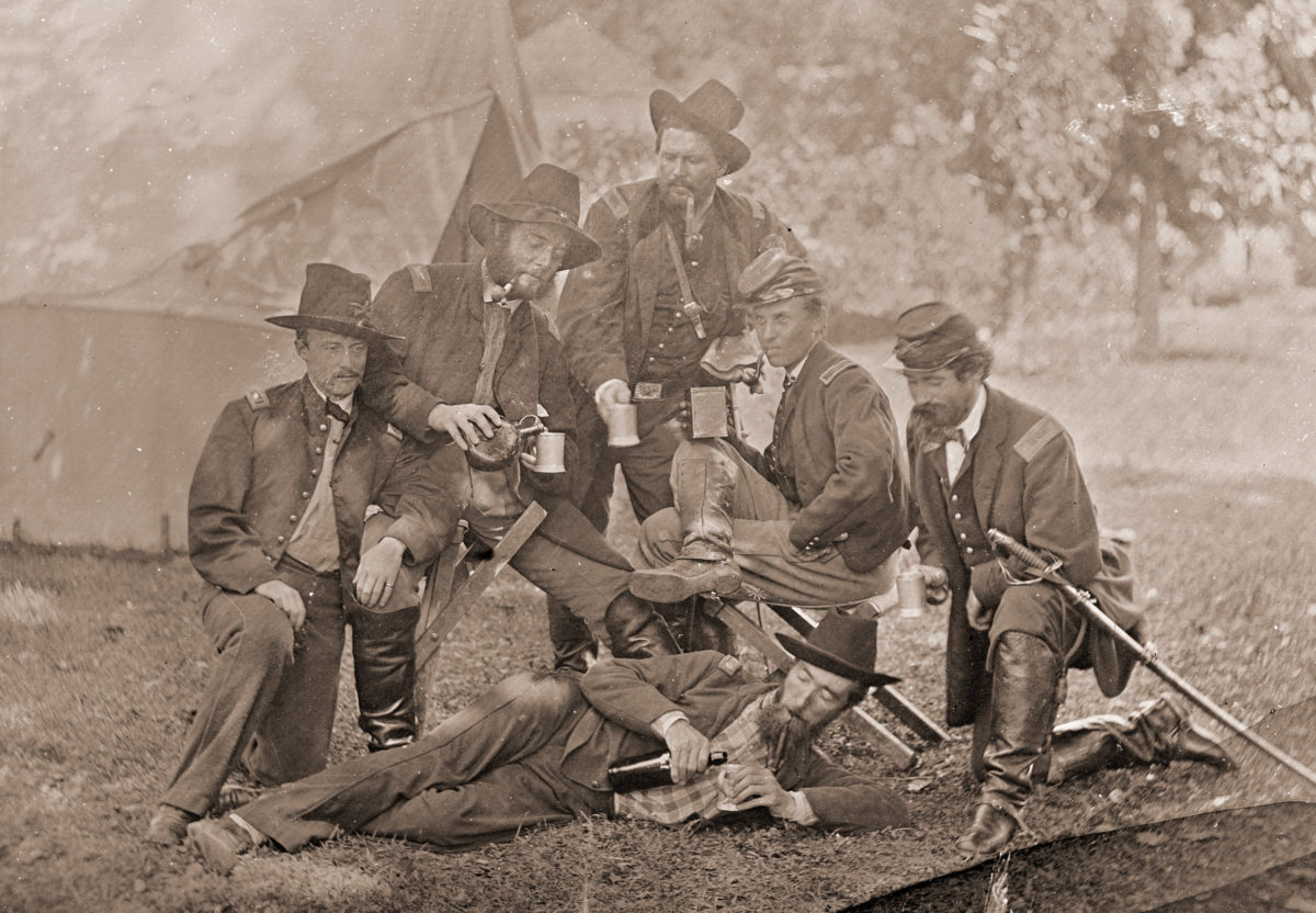 Group of Union officers drinking liquor in camp