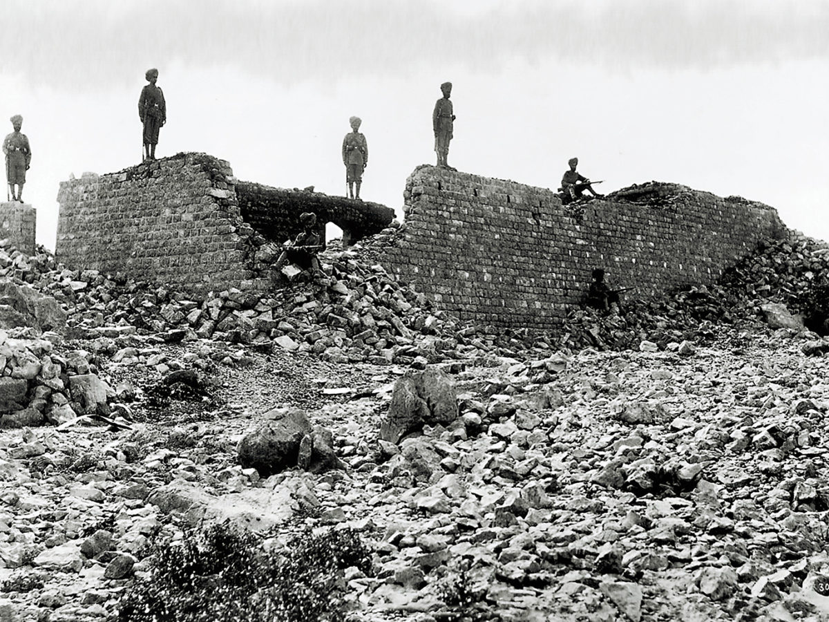 Photo of Sikh soldiers of the British Indian army pose amid the charred ruins of the Saragarhi heliograph station.