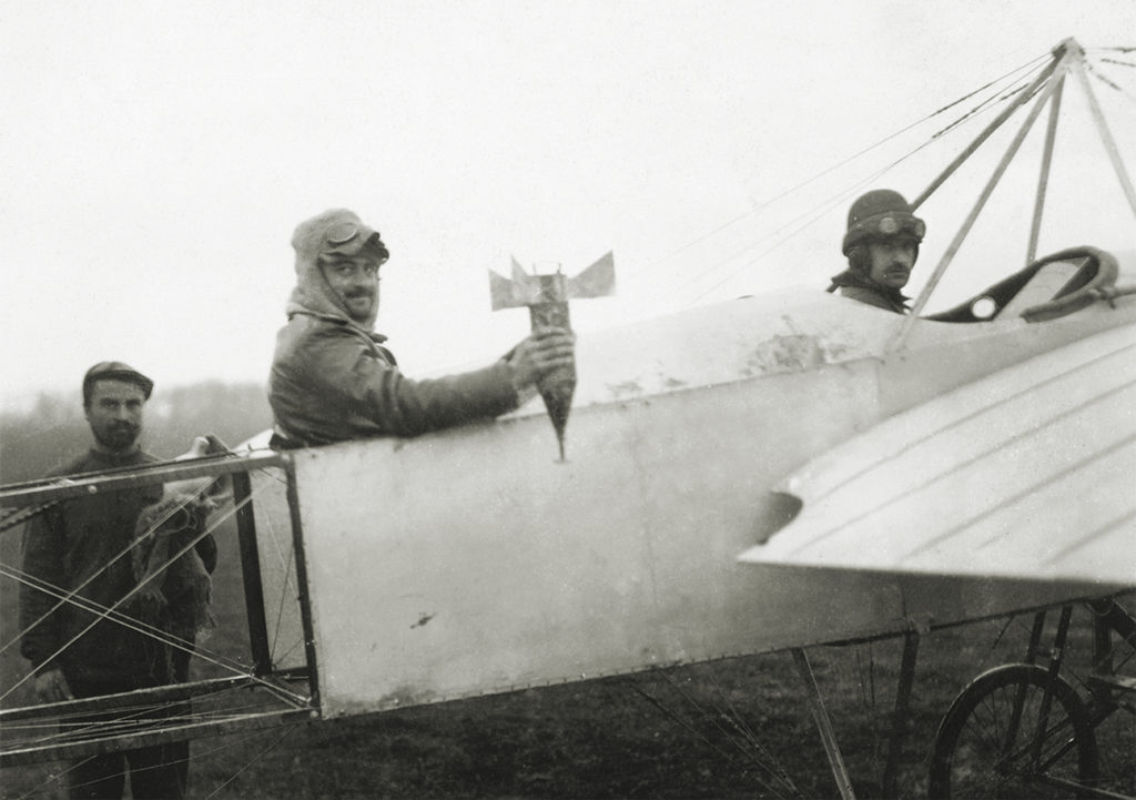 Photo of Bulgarian airmen prepare for a mission to drop a bomb by hand on Adrianople (now Edirne, Turkey), from their Bleriot XI aircraft, during the First Balkan War, circa 1913. The Bulgarian Air Force was the first to use aircraft for offensive military action.