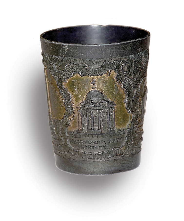 Photo of a whiskey tumbler that features the Pennsylvania Monument, the largest on the battlefield.