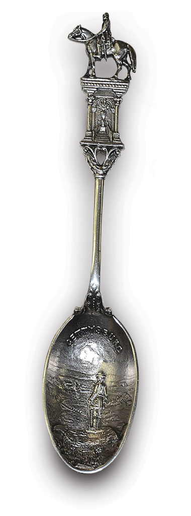 Photo of Blue and gray are commemorated on this silver spoon. General Robert E. Lee sits astride Traveller on the handle, while Maj. Gen. Gouverneur Warren forever gazes out from Little Round Top on the bowl.