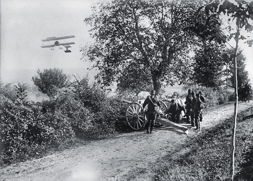 FRANCE - CIRCA 1910: Artillery manoeuvres, guided by a plane, at the camp of Chalons-sur-Marne (Marne), on August 1910.
