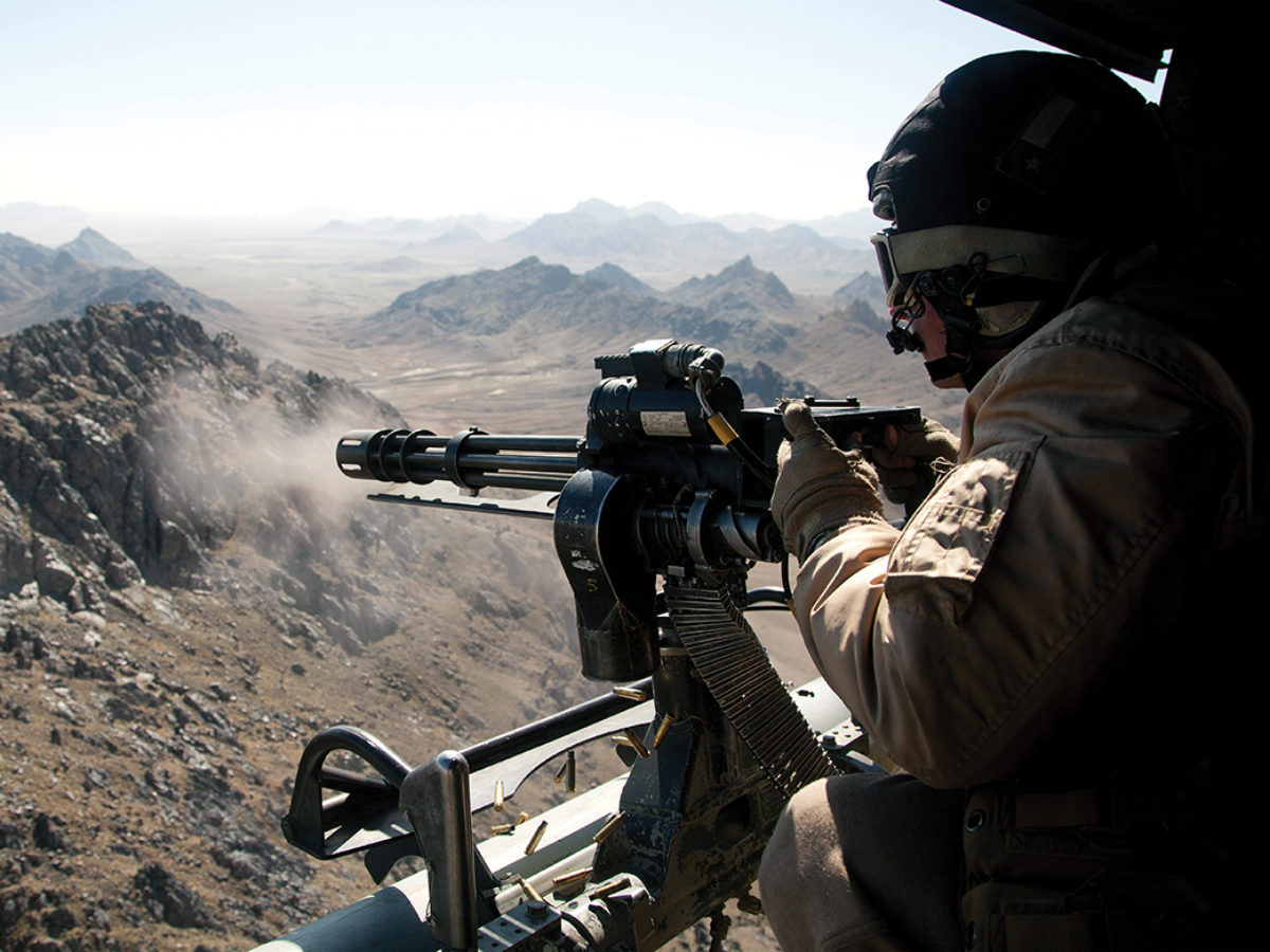 Photo of U.S. Marine Corps Sgt. Samuel Galan, a UH-1Y Venom crew chief assigned to Marine Light Helicopter Attack Squadron (HMLA) 169, opens fire while conducting an interdiction mission over Helmand province, Afghanistan, Feb. 3, 2013. Galan, from Houston, Texas, is deployed to Afghanistan in support of Operation Enduring Freedom. (U.S. Marine Corps