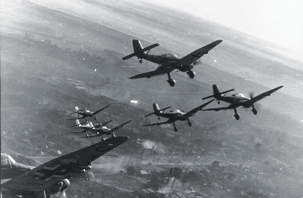 Photo of Junkers Ju 87D Stukas peel off to attack a Soviet road column in a classic use of the dive bomber as “flying artillery”—provided there is no aerial opposition.