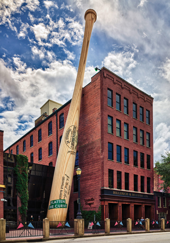 Photo of A giant baseball bat outside the Louisville Slugger Museum and Factory in Louisville, Kentuckyís largest city, along the winding Ohio River. Louisville Slugger is a brand of baseball bat produced by the Hillerich & Bradsby Company.